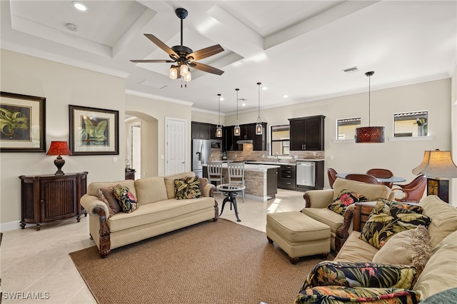 12108 Sussex St, Fort Myers, FL 33913 - living room featuring arched walkways, recessed lighting, coffered ceiling, ceiling fan, and light tile patterned floors