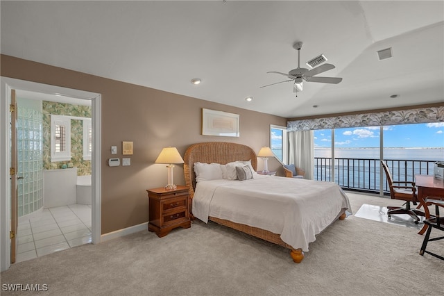 bedroom with light colored carpet, visible vents, baseboards, vaulted ceiling, and access to exterior