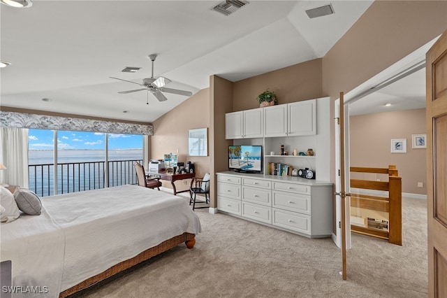 bedroom featuring light carpet, access to exterior, visible vents, and lofted ceiling