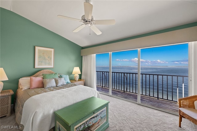 carpeted bedroom featuring vaulted ceiling, a water view, a ceiling fan, and access to exterior