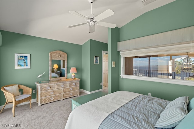 bedroom with lofted ceiling, ceiling fan with notable chandelier, carpet flooring, visible vents, and baseboards