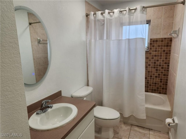 full bathroom featuring shower / tub combo, tile patterned flooring, vanity, and toilet