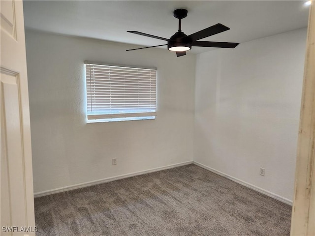 unfurnished room with carpet flooring, ceiling fan, and baseboards