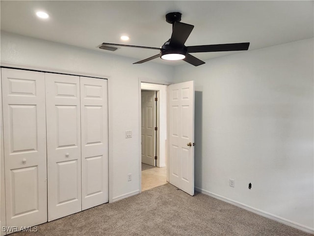 unfurnished bedroom featuring baseboards, visible vents, light colored carpet, a closet, and recessed lighting