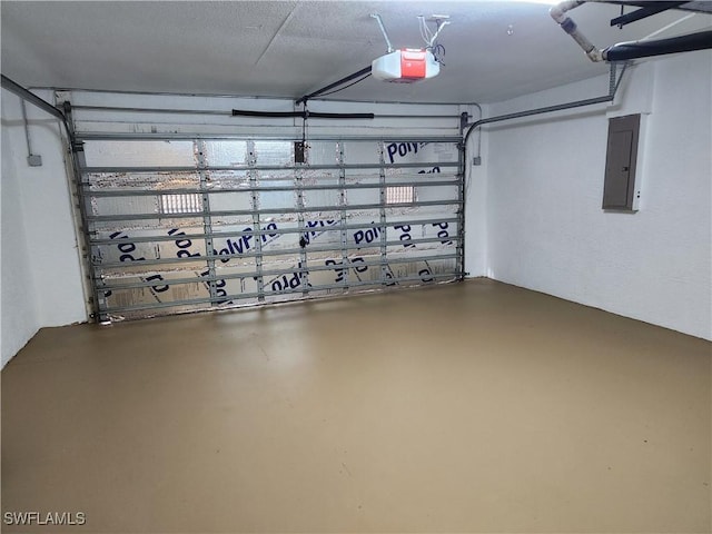 garage featuring electric panel and a garage door opener