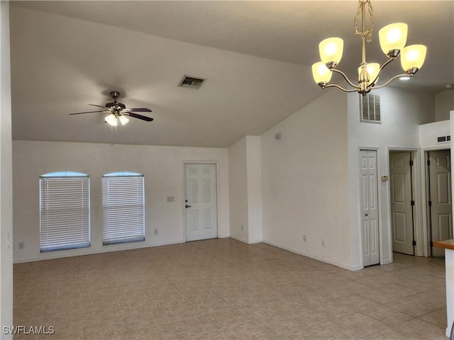 unfurnished living room with ceiling fan with notable chandelier, vaulted ceiling, visible vents, and baseboards