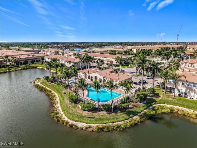 bird's eye view featuring a water view and a residential view