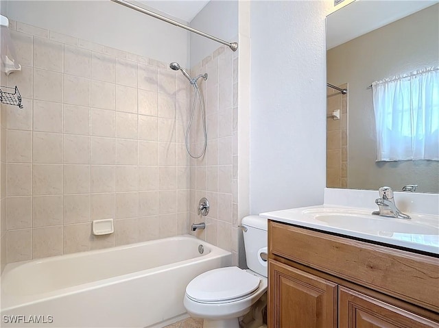 bathroom with shower / bath combination, vanity, and toilet