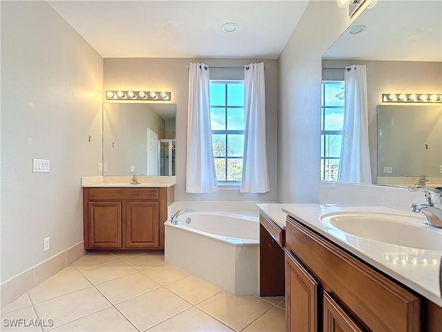 bathroom featuring a shower stall, a sink, a bath, and tile patterned floors