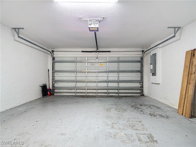 garage featuring a garage door opener and electric panel