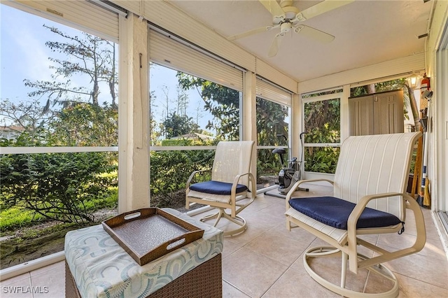 sunroom with a ceiling fan