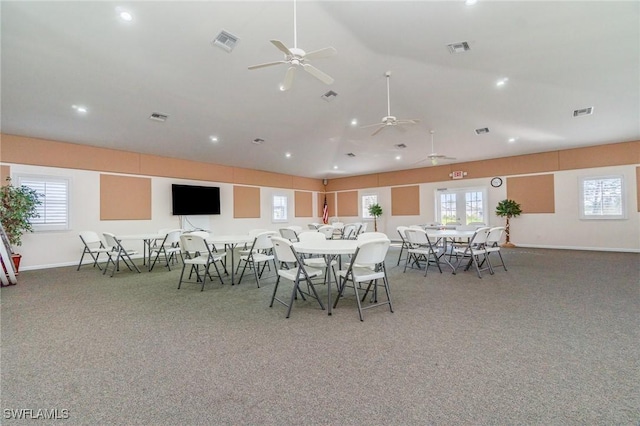 carpeted dining area featuring visible vents