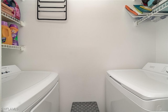 washroom featuring laundry area and independent washer and dryer