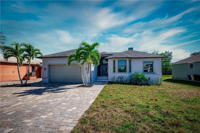 single story home with a garage, a front lawn, decorative driveway, and stucco siding