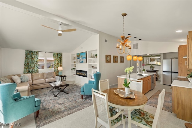 dining area featuring built in shelves, lofted ceiling, a glass covered fireplace, baseboards, and ceiling fan with notable chandelier