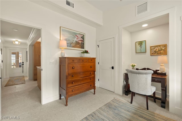 home office featuring baseboards, visible vents, and ornamental molding