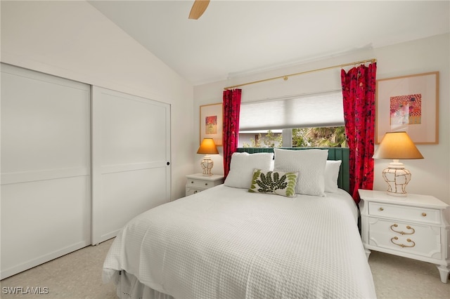 bedroom featuring a ceiling fan, a closet, and vaulted ceiling