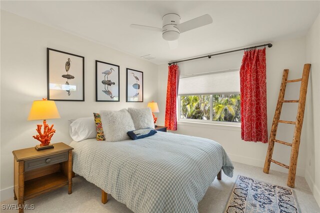 bedroom with ceiling fan and baseboards