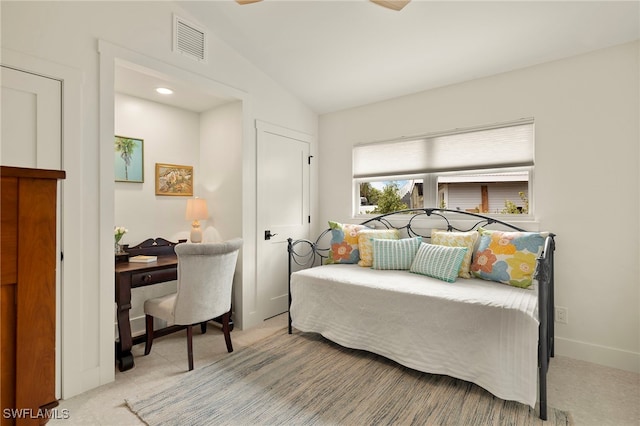 bedroom with visible vents, vaulted ceiling, and baseboards