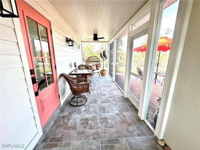 sunroom featuring wood ceiling