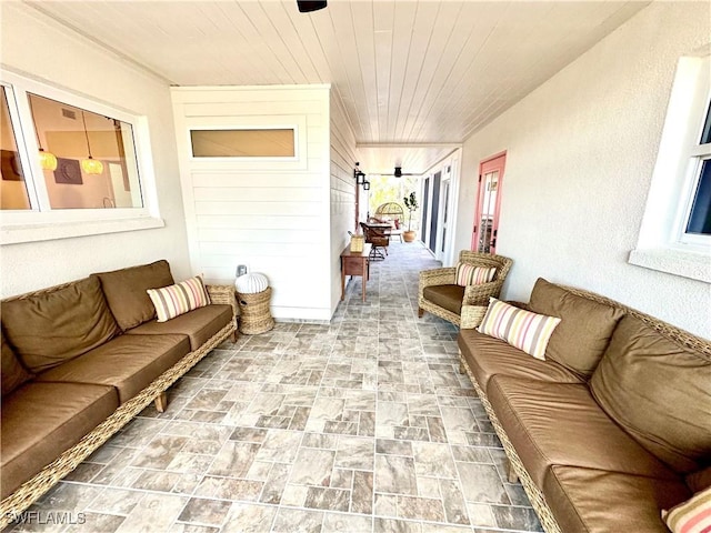 sunroom / solarium featuring wooden ceiling