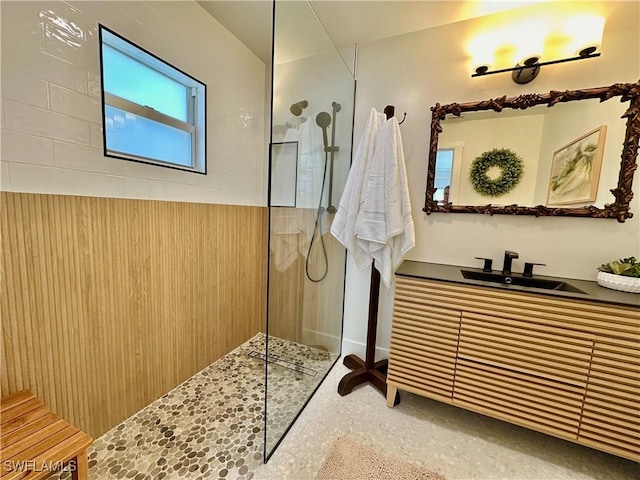 bathroom featuring vanity and a walk in shower