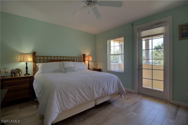 bedroom with light wood-type flooring, access to outside, baseboards, and a ceiling fan