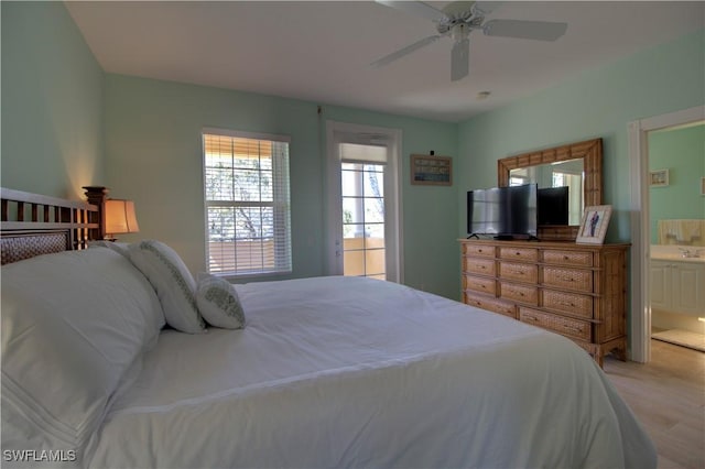 bedroom with ceiling fan and ensuite bath