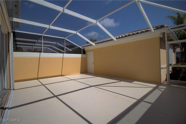 view of patio with a lanai