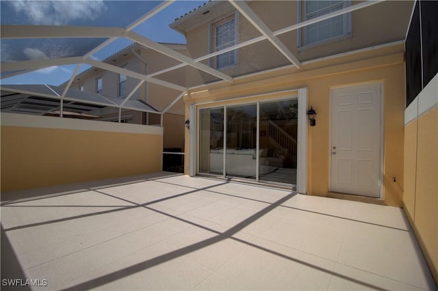 view of patio / terrace with glass enclosure