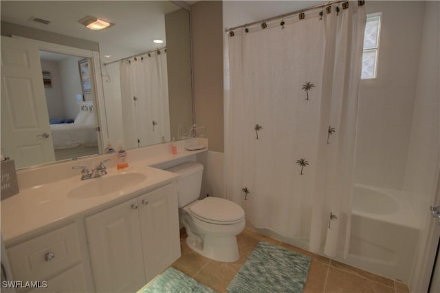 ensuite bathroom featuring visible vents, toilet, connected bathroom, vanity, and tile patterned floors