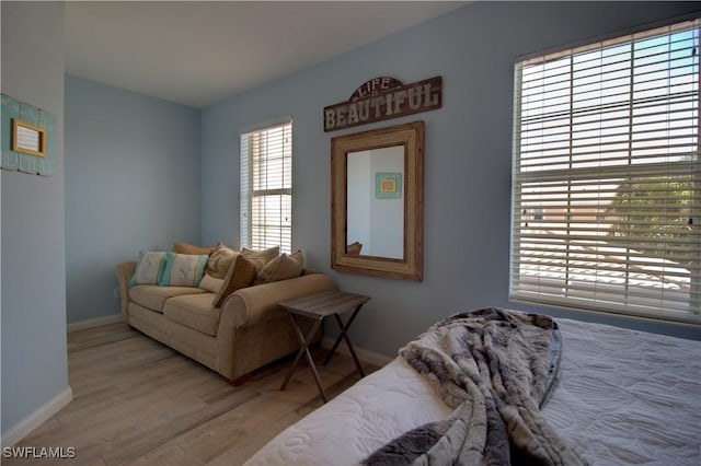 interior space featuring baseboards and wood finished floors