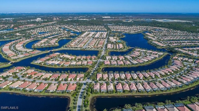 aerial view featuring a residential view and a water view