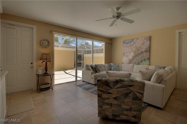 living area featuring ceiling fan and light tile patterned flooring