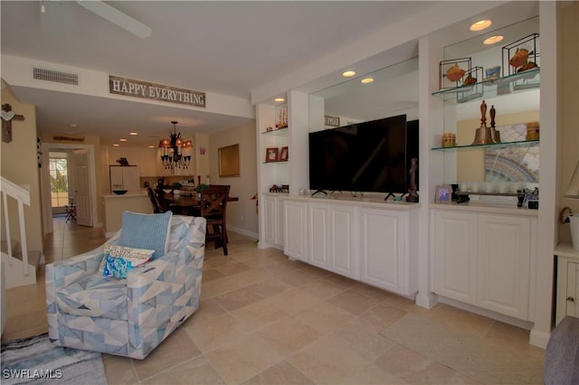 living area featuring built in features, recessed lighting, visible vents, and baseboards