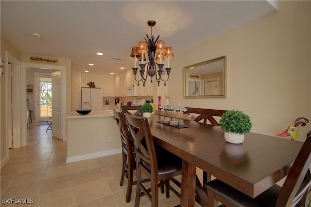 dining space with recessed lighting, light tile patterned flooring, a notable chandelier, and baseboards