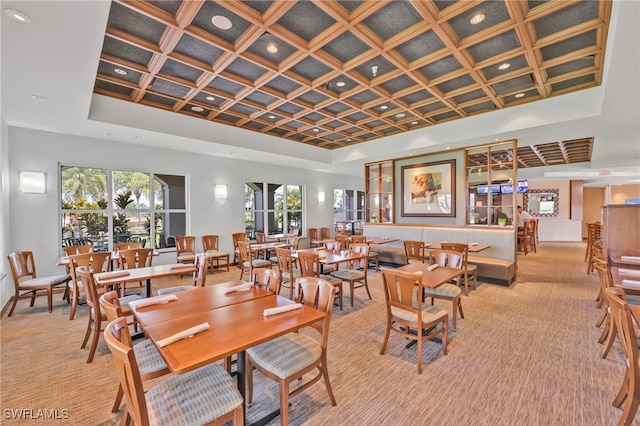 dining room featuring a raised ceiling, recessed lighting, and light colored carpet