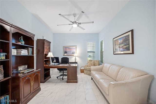 home office with marble finish floor and a ceiling fan