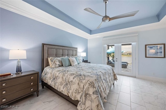 bedroom with access to exterior, baseboards, marble finish floor, and a tray ceiling