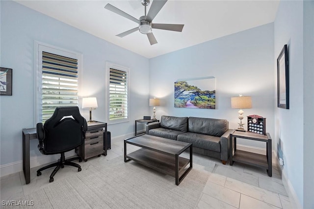 home office with baseboards and a ceiling fan