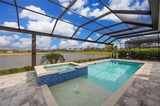 view of swimming pool with a patio, a water view, a pool with connected hot tub, and a lanai