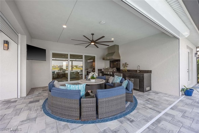 view of patio / terrace featuring a sink, area for grilling, and ceiling fan