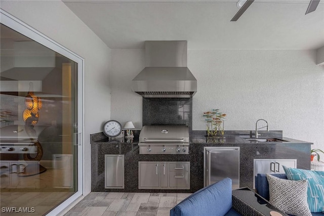 view of patio / terrace featuring an outdoor kitchen, a grill, and a sink