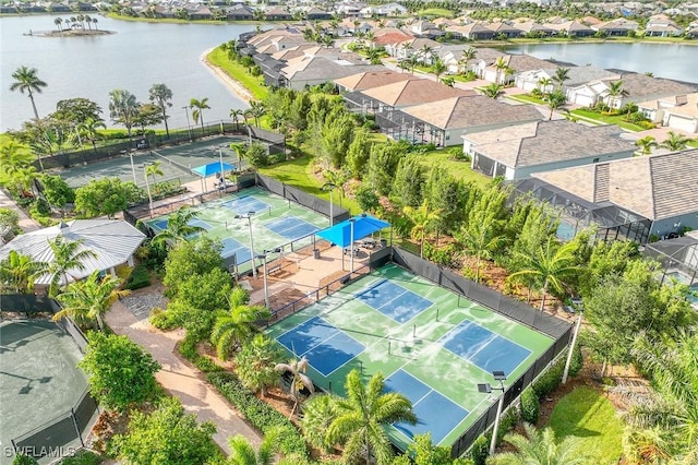 aerial view with a residential view and a water view