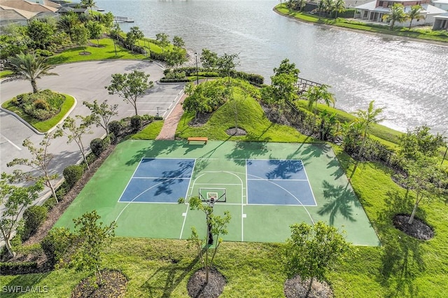 view of basketball court with a tennis court and a water view