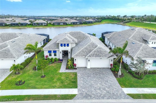 bird's eye view featuring a residential view and a water view