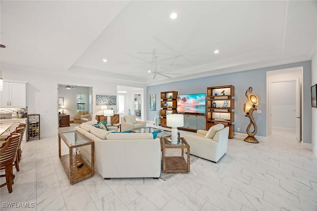 living area featuring recessed lighting, baseboards, ceiling fan, and ornamental molding