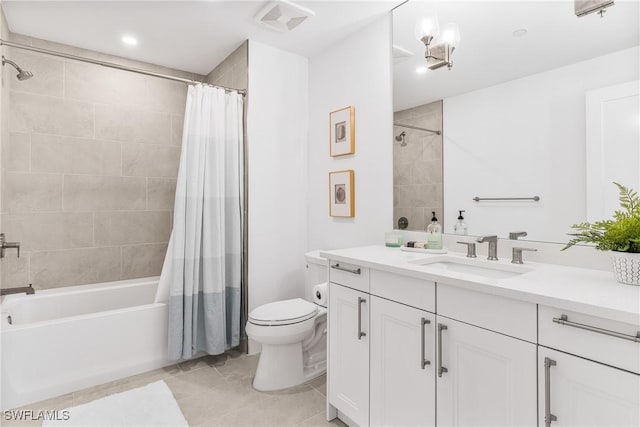 bathroom with visible vents, vanity, shower / bath combo with shower curtain, and toilet