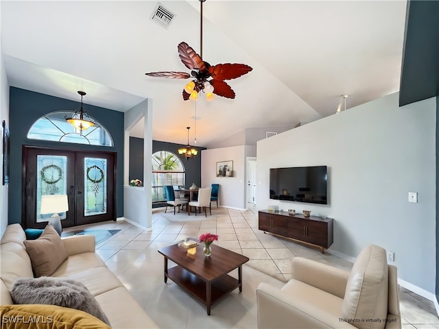 living area featuring french doors, visible vents, baseboards, and light tile patterned floors