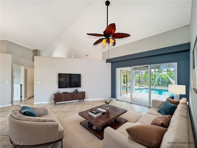 living room with high vaulted ceiling, light tile patterned flooring, a ceiling fan, and baseboards